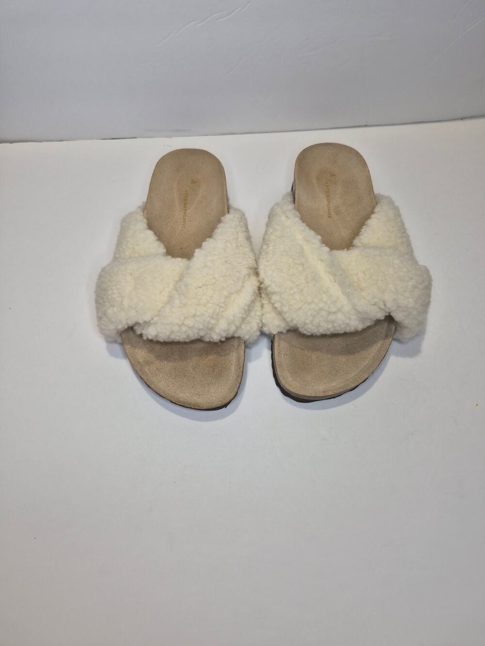 Anthropologie faux fur cream color, size 40 comfort slippers.
